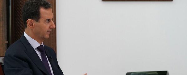 Президент Сирийской Арабской Республики Башар Асад во время интервью в Сирии заместителю главного редактора - директору главной дирекции информации МИА Россия сегодня Дмитрию Горностаеву. Президент Сирийской Арабской Республики Башар Асад во время интервью в Сирии заместителю главного редактора - директору главной дирекции информации МИА Россия сегодня Дмитрию Горностаеву. - Sputnik Кыргызстан
