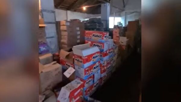 В Бишкеке нашли склад, где перебивали даты выпуска сладостей — видео - Sputnik Кыргызстан