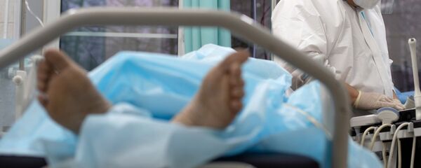 Пациент в больничной койке. Архивное фото - Sputnik Кыргызстан