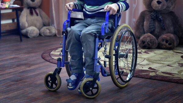 Ребенок в инвалидной коляске. Архивное фото  - Sputnik Кыргызстан