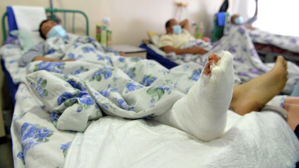 Пациент лежит на больничной койке. Архивное фото - Sputnik Кыргызстан