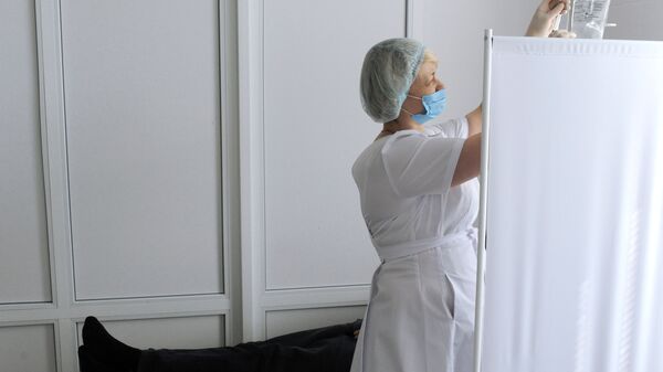 Медсестра в клинике. Архивное фото - Sputnik Кыргызстан