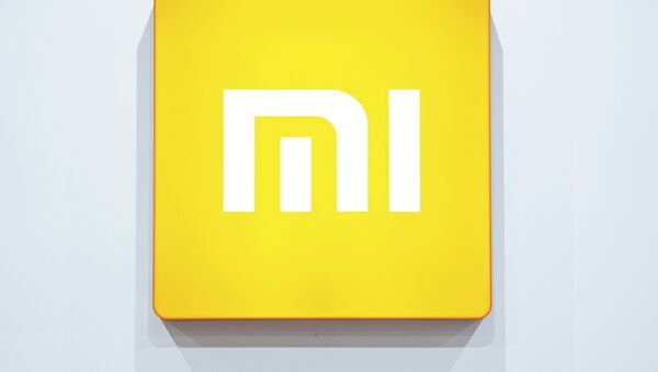 Логотип компании Xiaomi. Архивное фото - Sputnik Кыргызстан