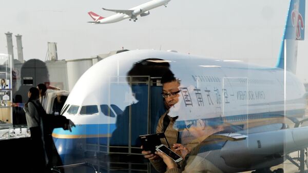 Люди в международном аэропорту Пекин-Шоуду. Архивное фото - Sputnik Кыргызстан