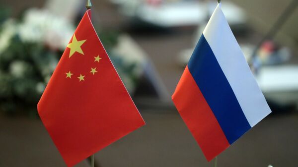 Флаги КНР и России. Архивное фото - Sputnik Кыргызстан