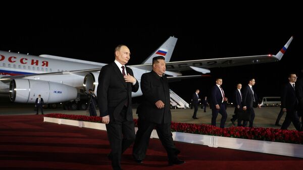 Президент России Владимир Путин и лидер КНДР Ким Чен Ын  - Sputnik Кыргызстан