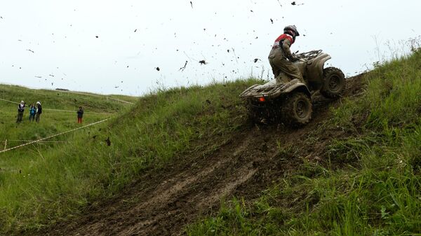 Участник соревнований на квадроциклах. Архивное фото - Sputnik Кыргызстан