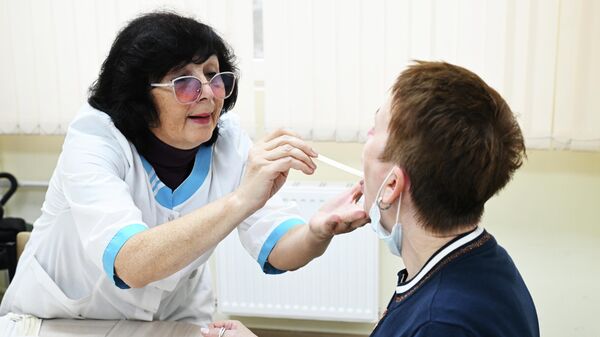 Женщина на приеме у врача. Архивное фото - Sputnik Кыргызстан