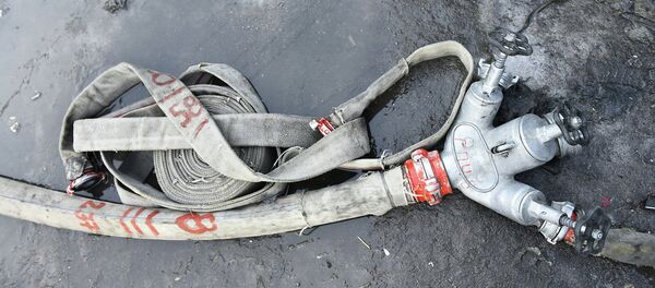 Пожарный шланг. Архивное фото - Sputnik Кыргызстан