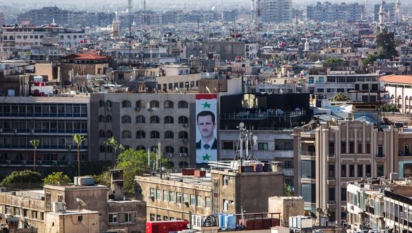 Портрет президента Сирии Башара Асада на стене дома в центре Дамаска. Архивное фото - Sputnik Кыргызстан