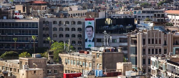 Портрет президента Сирии Башара Асада на стене дома в центре Дамаска. Архивное фото - Sputnik Кыргызстан