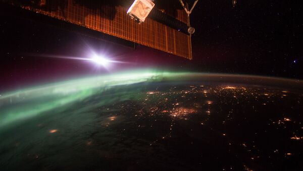 Фотография полярного сияния, сделанная с борта Международной космической станции. - Sputnik Кыргызстан