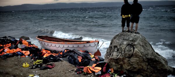 Деңиз жээгиндеги качкындар. Архив - Sputnik Кыргызстан