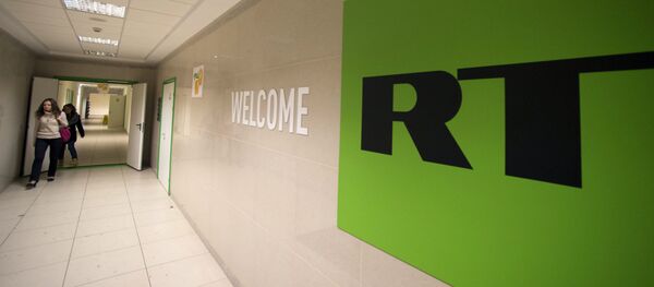 Логотип телеканала Russia Today. Архивное фото - Sputnik Кыргызстан