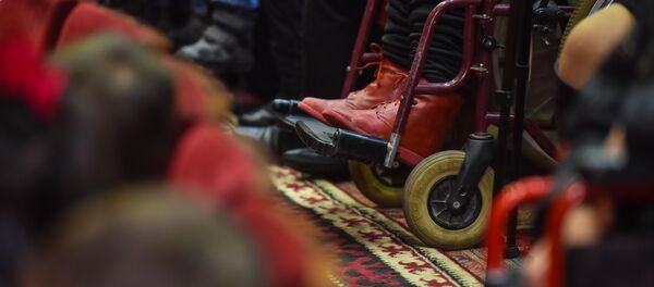 Человек в инвалидной коляске. Архивное фото Человек в инвалидной коляске. Архивное фото - Sputnik Кыргызстан