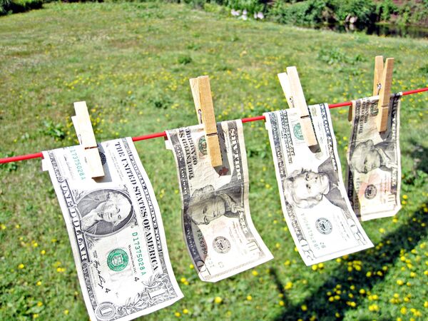 Доллары США на сушилке. Архивное фото - Sputnik Кыргызстан