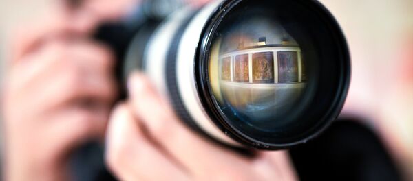 Фотограф на выставке. Архивное фото Фотограф на выставке. Архивное фото - Sputnik Кыргызстан