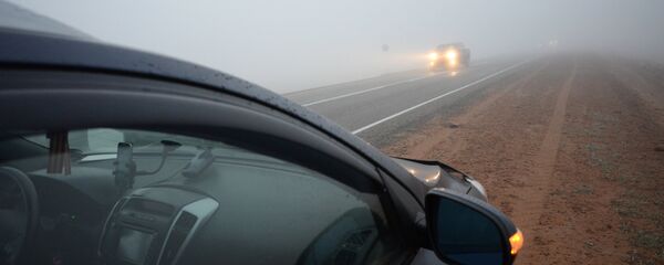 Жолдун четинде токтоп турган унаа. Архив - Sputnik Кыргызстан