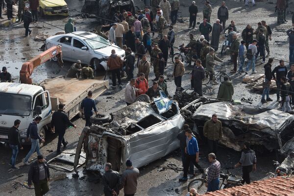 На месте террористического акта в сирийском городе Хомс. - Sputnik Кыргызстан
