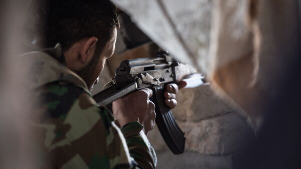 Вооруженный мужчина в Сирии. Архивное фото - Sputnik Кыргызстан