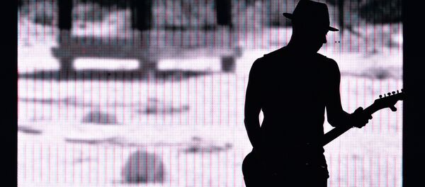 Гитарист во время концерта. Архивное фото - Sputnik Кыргызстан