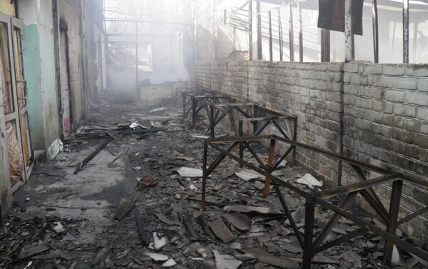 Последствия пожара на рынке Исфаны уничтоживший 700 квадратных метров. Архивное фото - Sputnik Кыргызстан