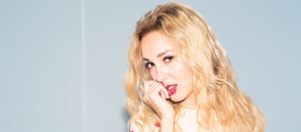 Теле- и радиоведущая Ольга Ковалева. Архивное фото - Sputnik Кыргызстан