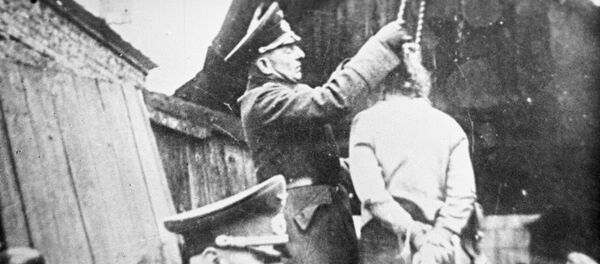 Кадр документальной кинохроники. Великая Отечественная война 1941 - 1945 годов. Карательные акции фашистов на оккупированной территории Белоруссии. Архивное фото - Sputnik Кыргызстан