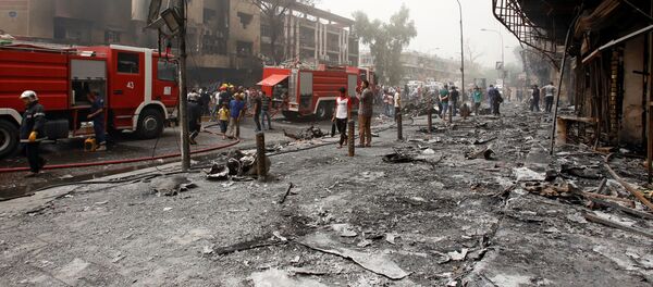 Ирактын борбору Багдад шаарынын Аль-Каррада аймагында болгон жардыруудан кийинки абал. - Sputnik Кыргызстан