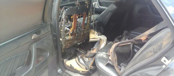 Сгоревший салон автомобиля спикера Каракольского горкенеша Эрлан Айсаракунова - Sputnik Кыргызстан