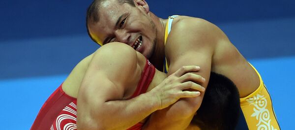 Борец греко-римского стиля Жанарбек Кенжеев во время соревнований. Архивное фото - Sputnik Кыргызстан
