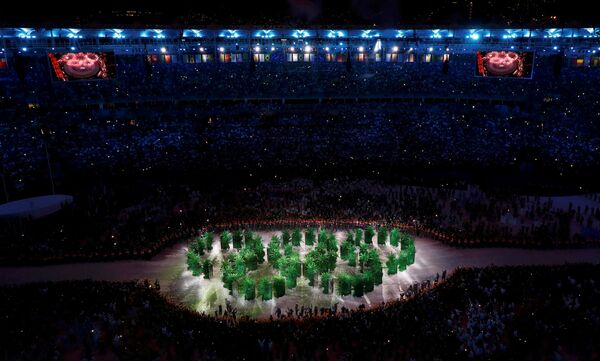 Рио-де-Жанейродогу Маракана стадионунда XXXI Олимпиада оюндарынын ачылыш салтанаты болуп, ал Бразилиянын тарыхын, саясий, экономикалык жана социалдык абал чагылдырылган чоң концерт менен коштолду - Sputnik Кыргызстан