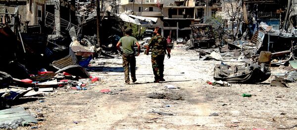 Архивное фото бойцов сирийской армии на территории освобожденного района Рамусе на юге Алеппо Архивное фото бойцов сирийской армии на территории освобожденного района Рамусе на юге Алеппо - Sputnik Кыргызстан