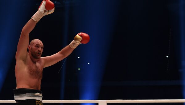 Чемпион мира по боксу в тяжелом по версиям WBA, WBO и IBO Тайсон Фьюри после боя - Sputnik Кыргызстан