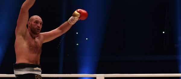Чемпион мира по боксу в тяжелом по версиям WBA, WBO и IBO Тайсон Фьюри после боя - Sputnik Кыргызстан