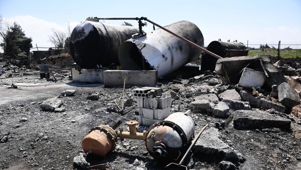 Последствия ракетного удара США по авиабазе в Сирии - Sputnik Кыргызстан