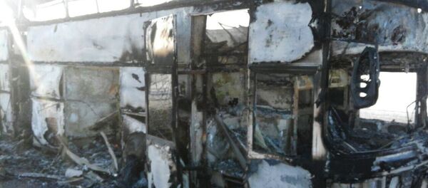 Автобус, сгоревший на трассе Самара - Шымкент в Иргизском районе Актюбинской области в Казахстане. - Sputnik Кыргызстан