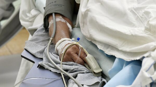Пациент в больничной койке. Архивное фото - Sputnik Кыргызстан