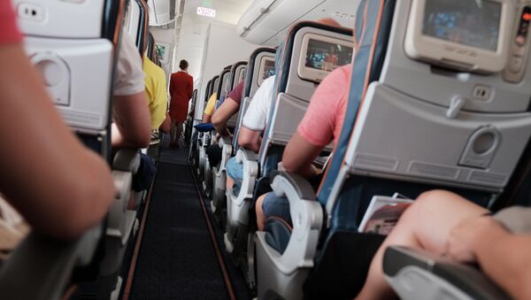 Пассажиры в самолете. Архивное фото - Sputnik Кыргызстан