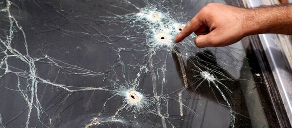 Следы от пуль на стекле автомобиля. Архивное фото - Sputnik Кыргызстан