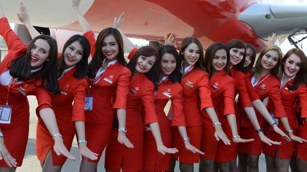 Малайзиялык Air Asia авиакомпаниясынын кызматкерлери - Sputnik Кыргызстан