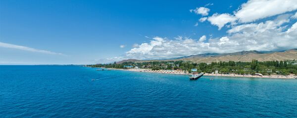 Вид на пляж Иссык-Куля. Архивное фото Вид на пляж Иссык-Куля. Архивное фото - Sputnik Кыргызстан