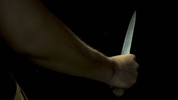 Человек с ножом в руке. Иллюстративное фото - Sputnik Кыргызстан