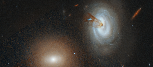 Спиральная галактика D100, стремительно теряющую газ Спиральная галактика D100, стремительно теряющую газ - Sputnik Кыргызстан