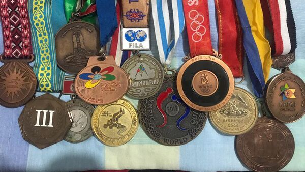 Медали бронзового призера Олимпийских игр Руслана Тюменбаева. Архивное фото - Sputnik Кыргызстан