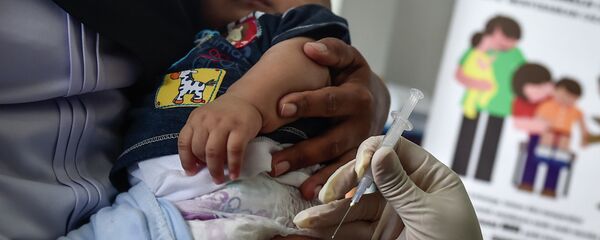 Вакцинация детей против кори и краснухи в Банда-Ачехе - Sputnik Кыргызстан