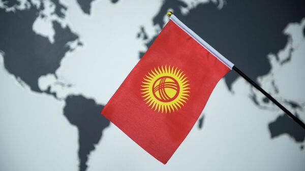 Флаг Кыргызстана на фоне карты мира. Архивное фото - Sputnik Кыргызстан