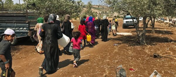 Женщины и дети на юго-западе сирийской провинции Дераа. Архивное фото Женщины и дети на юго-западе сирийской провинции Дераа. Архивное фото - Sputnik Кыргызстан