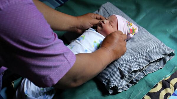 Рождение ребенка в Палембанге - Sputnik Кыргызстан