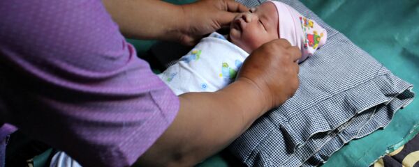 Рождение ребенка в Палембанге - Sputnik Кыргызстан